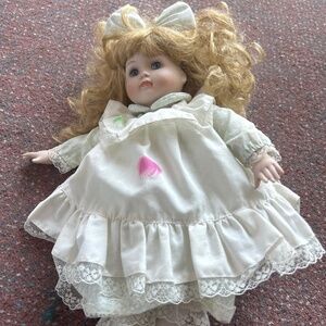 Porcelain music box blonde curly hair doll